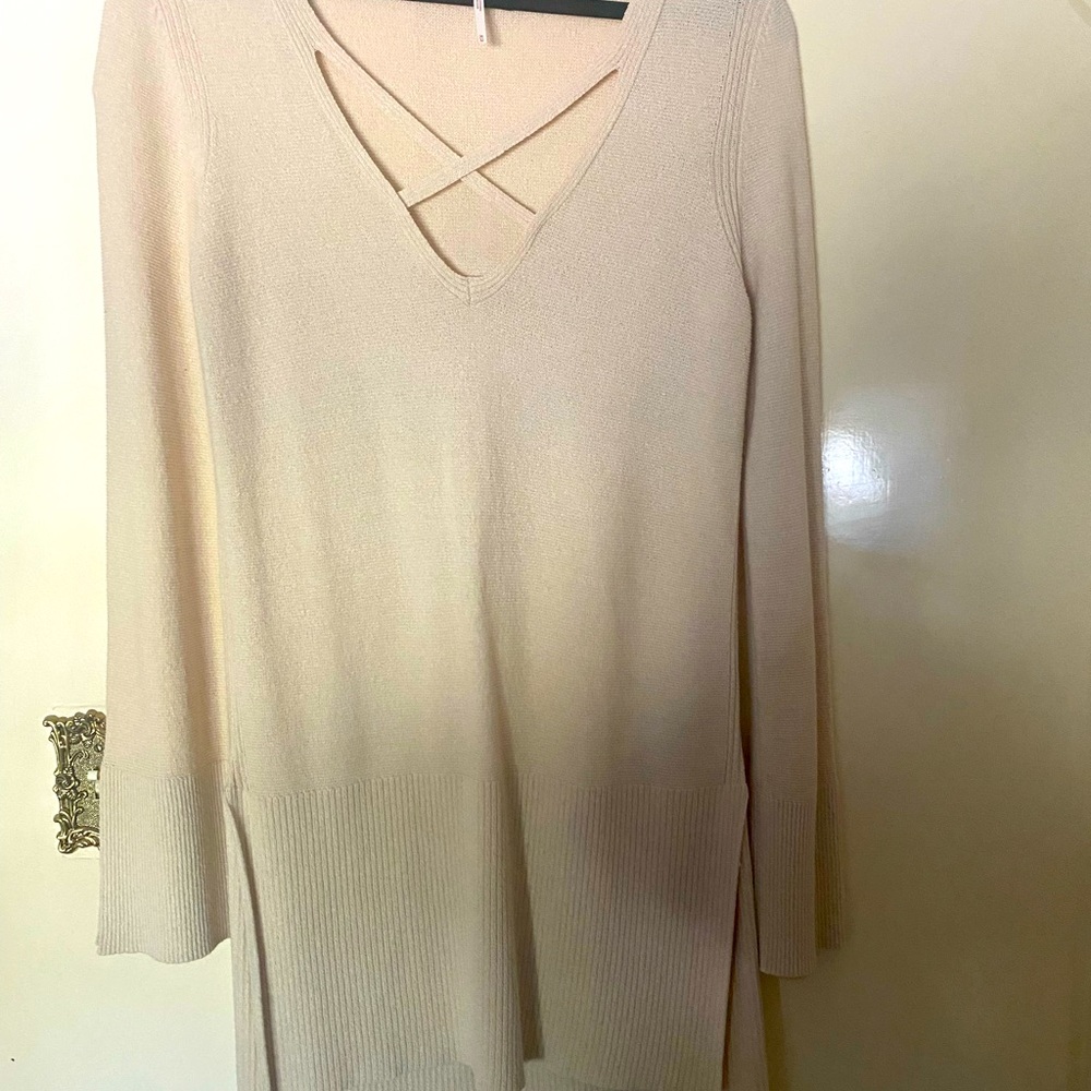 Free People sweater it’s longer in the back then the front Only had it on once